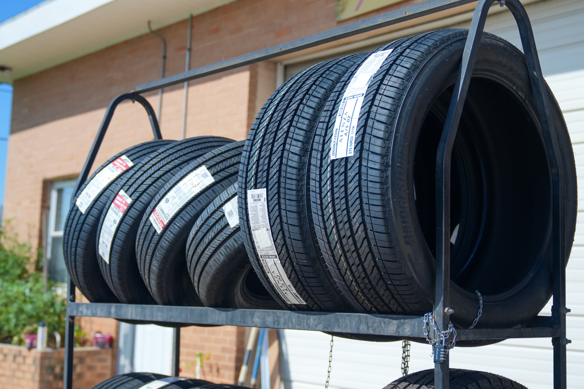 Rack of new tires out front of the shop